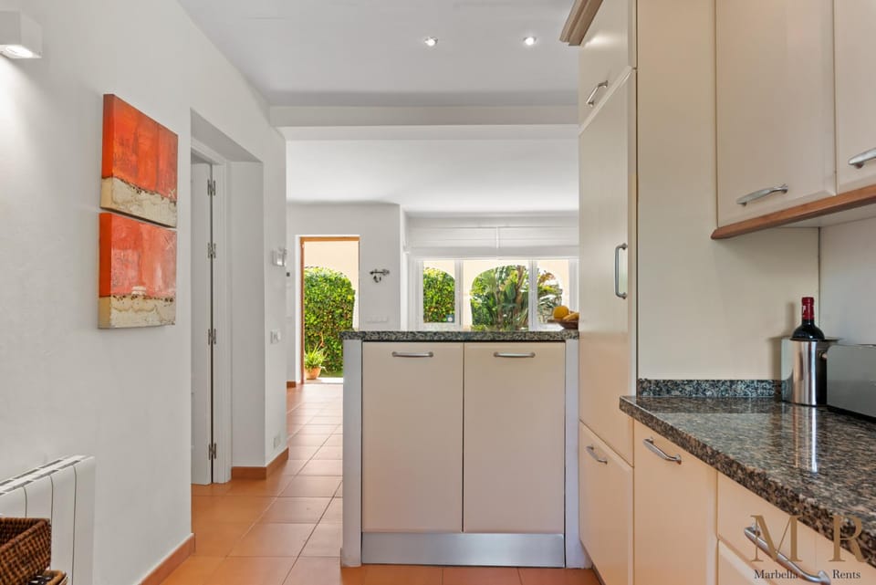 Kitchen or kitchenette, dishwasher, oven, stove