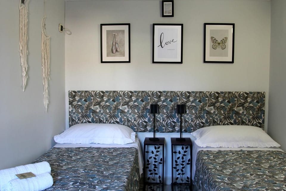 Shower, Bed, Inner courtyard view, hair dryier, towels, air conditioner
