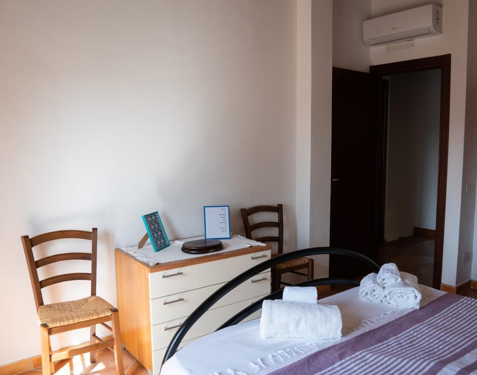 Bed, Bedroom, hair dresser, towels, air conditioner