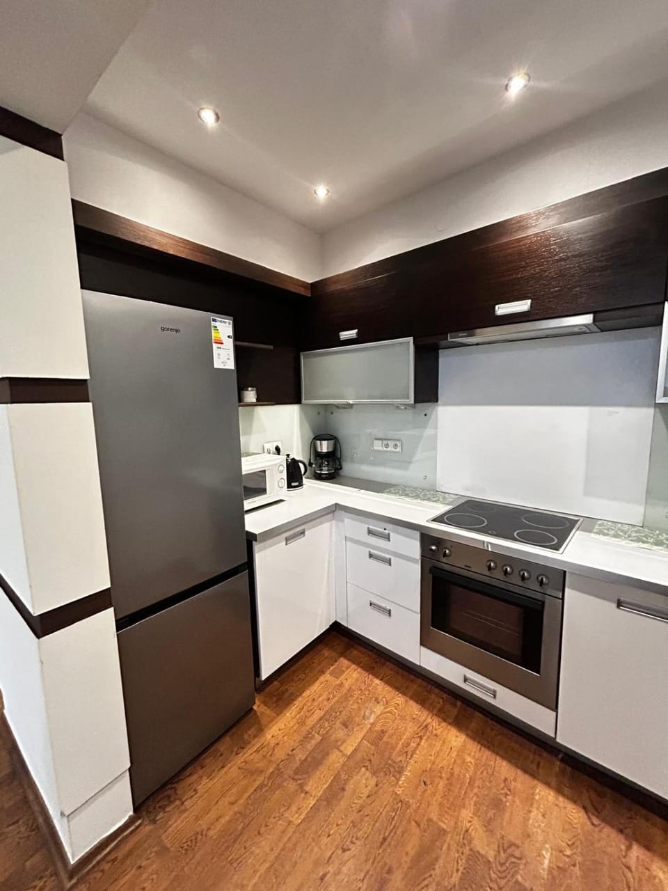 Kitchen or kitchenette, dishwasher, oven, stove, toaster