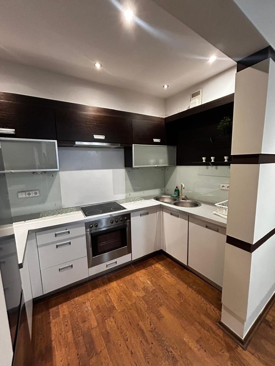 Kitchen or kitchenette, dishwasher, oven, stove