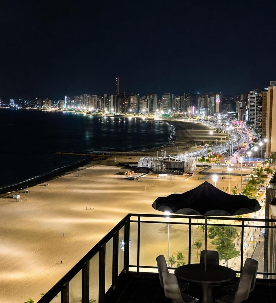 Property building, Patio, Nearby landmark, Night, Natural landscape, Bird's eye view, Balcony/Terrace, Beach, City view, Sea view