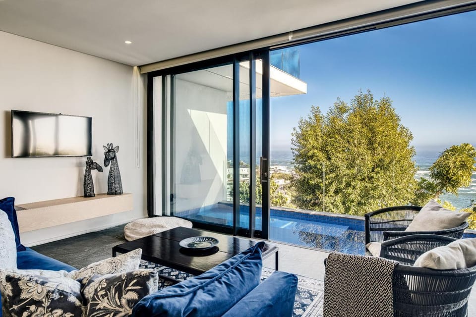 View (from property/room), Balcony/Terrace, Living room, Seating area, Pool view, Swimming pool