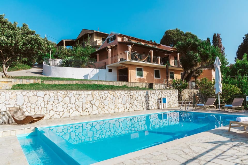 Property building, Day, Pool view, Swimming pool, sunbed