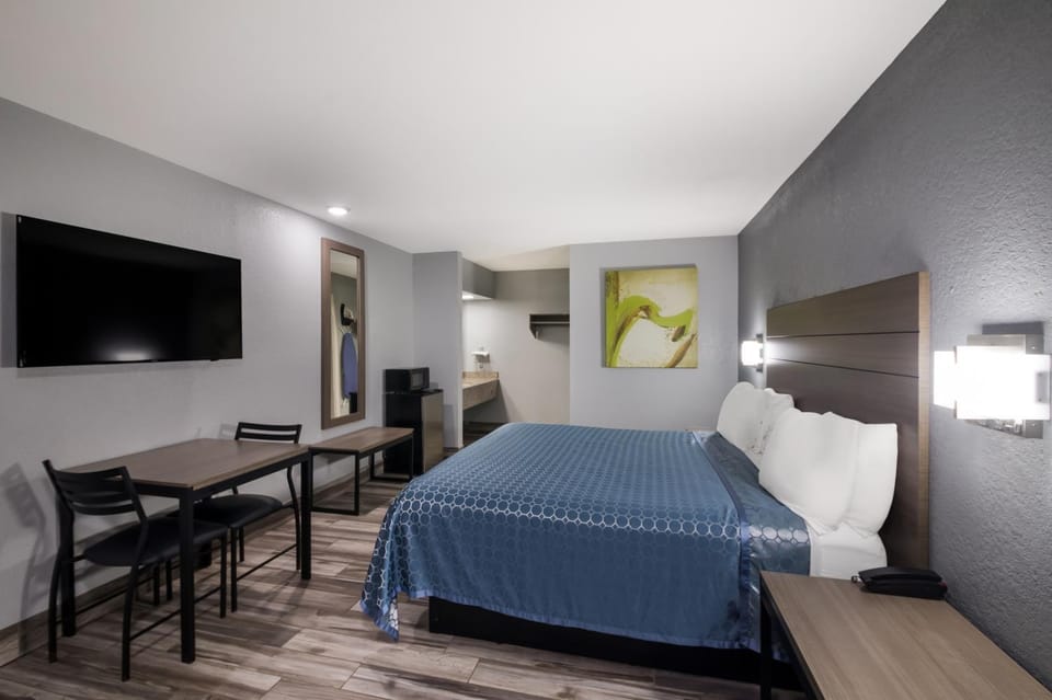 Bed, TV and multimedia, Seating area, Bedroom, hair dresser