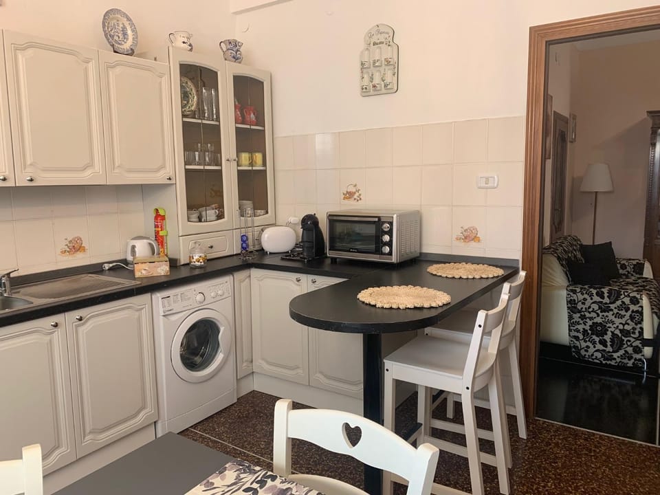 Kitchen or kitchenette, dishwasher, oven, stove, toaster, washing machine, kitchen