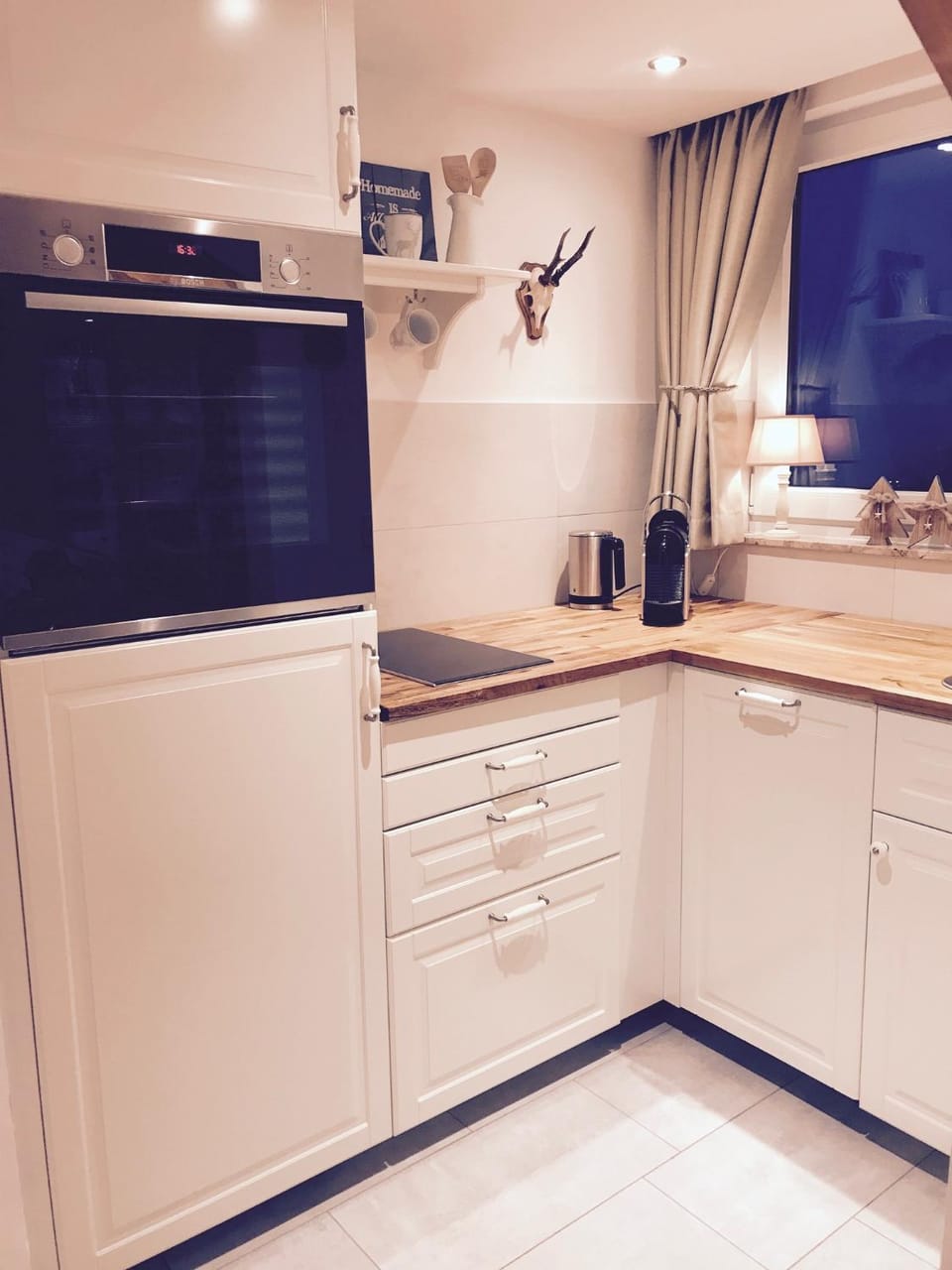 Kitchen or kitchenette, dishwasher, oven, stove