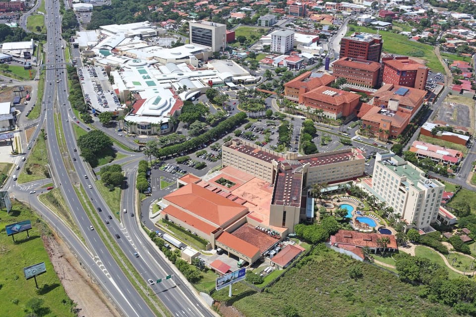 Property building, Nearby landmark, Day, Neighbourhood, Bird's eye view, Business facilities, City view, Landmark view, Street view, Shopping Area, Parking