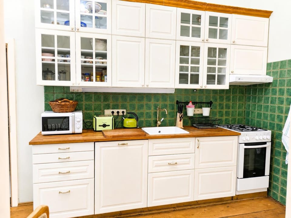 Kitchen or kitchenette, dishwasher, microwave, oven, stove, toaster