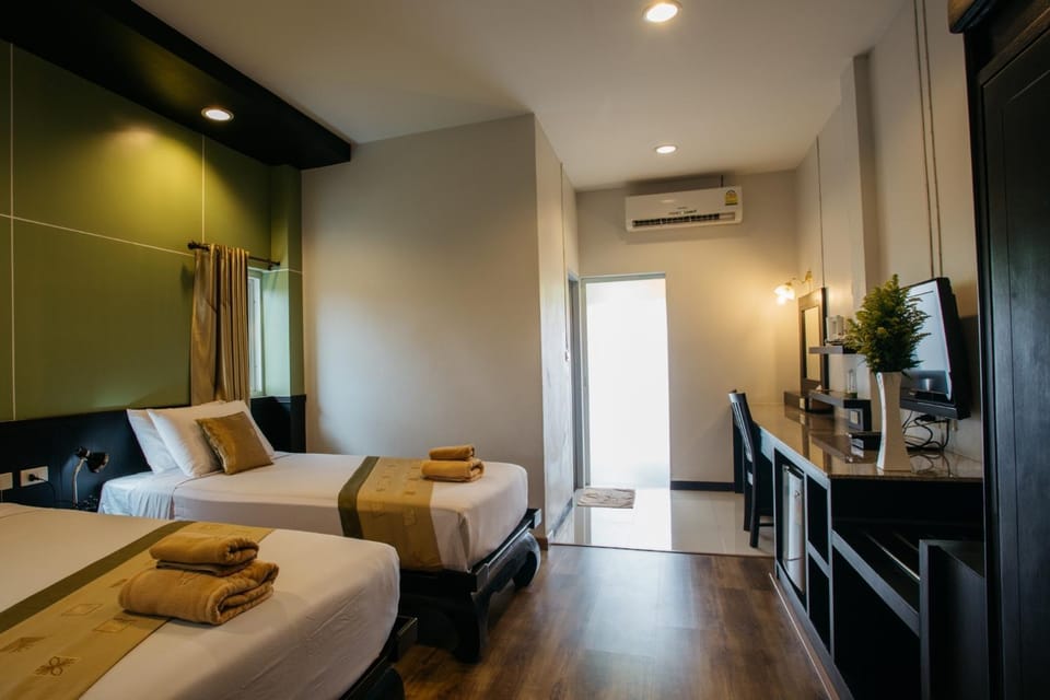 Photo of the whole room, Bedroom, hair dresser, towels