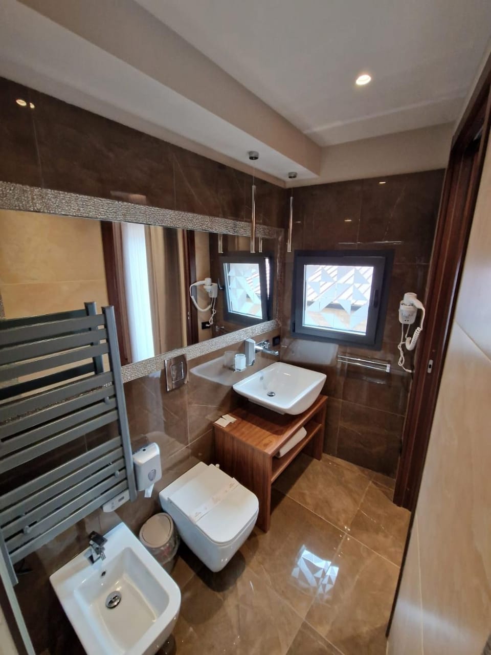 Toilet, Bathroom, bidet, hair dryier, towels