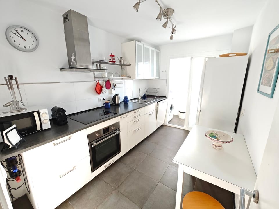 Kitchen or kitchenette, dishwasher, oven, stove, washing machine
