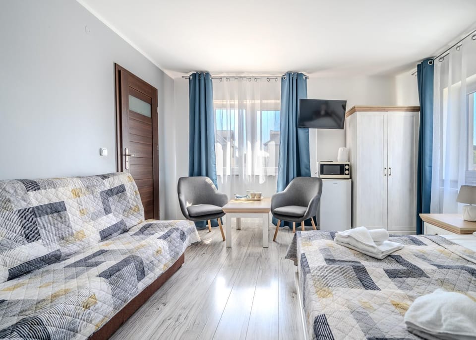 Bed, TV and multimedia, Seating area, microwave, wardrobe