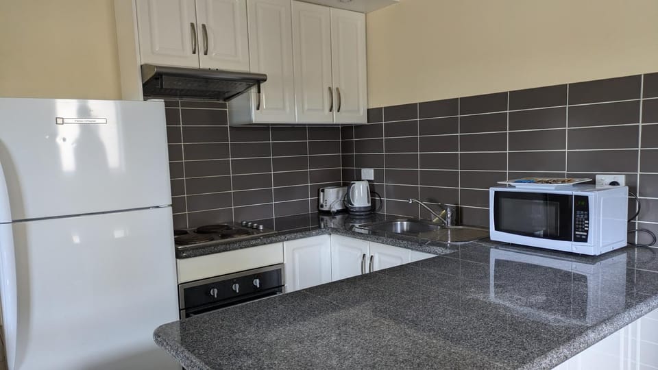 Kitchen or kitchenette, oven, stove, kitchen