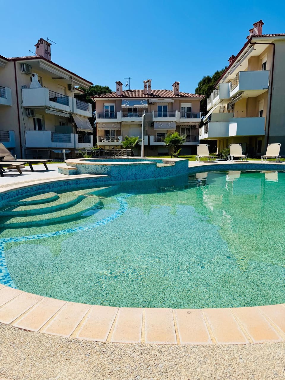 Property building, Pool view, Swimming pool, sunbed