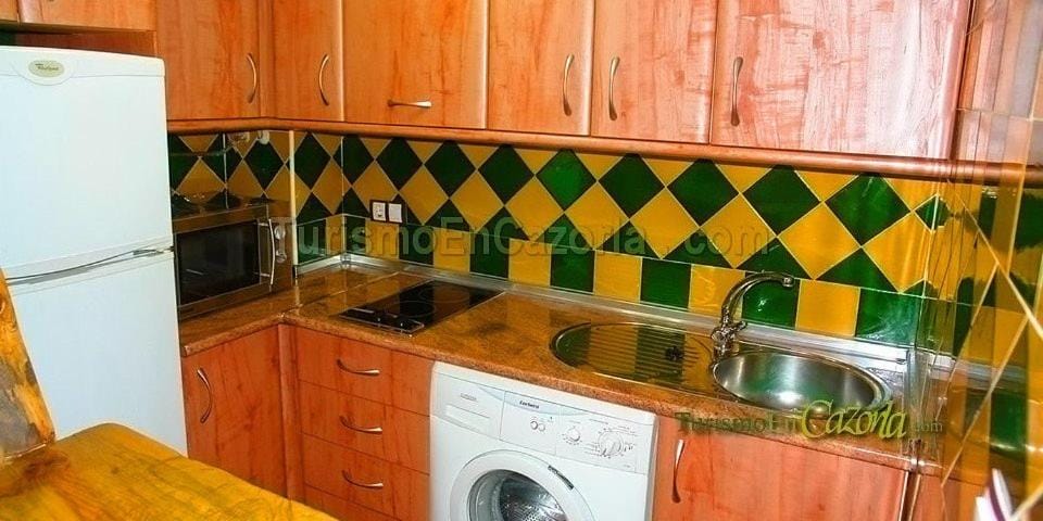 Kitchen or kitchenette, stove, washing machine