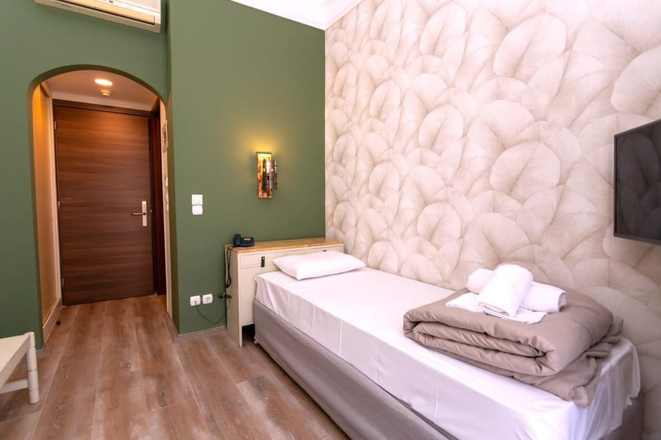 Bed, towels, wardrobe