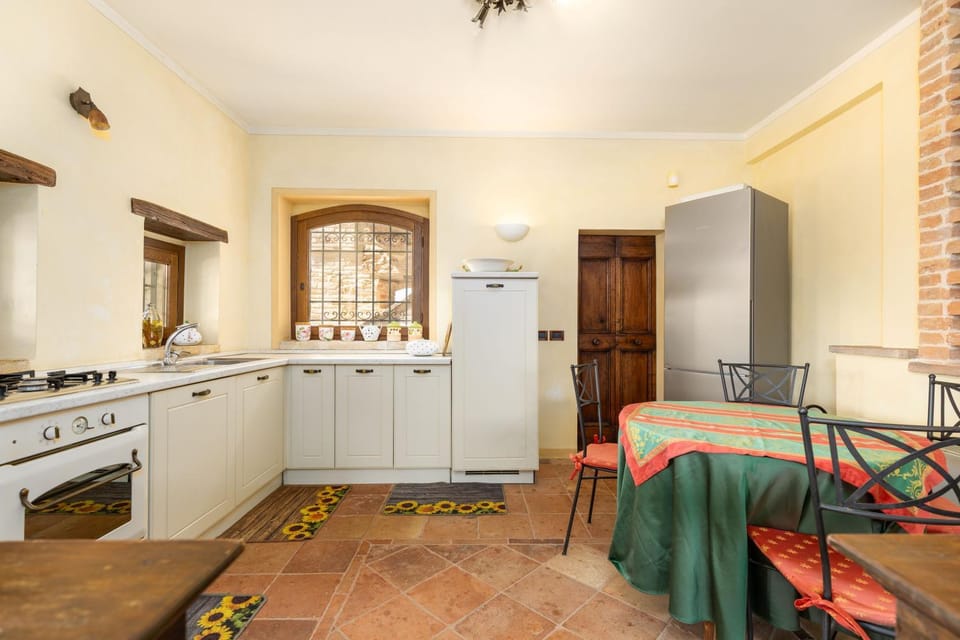 Kitchen or kitchenette, dishwasher, oven, stove
