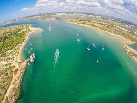 Property building, Nearby landmark, Day, Natural landscape, Beach, River view, Sea view