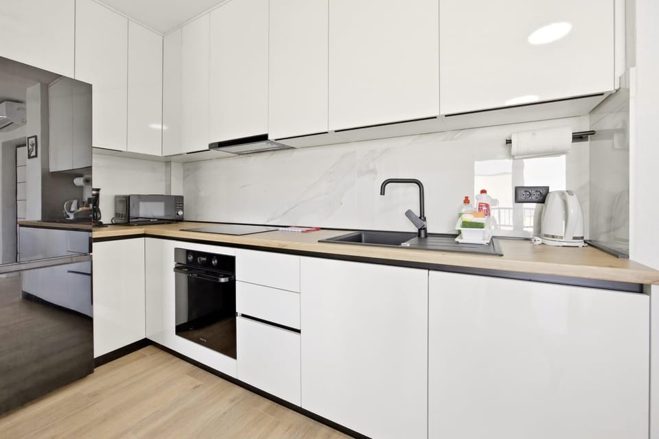 Kitchen or kitchenette, dishwasher, microwave, oven, stove, kitchen