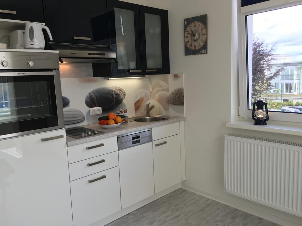 Kitchen or kitchenette, dishwasher, stove, toaster