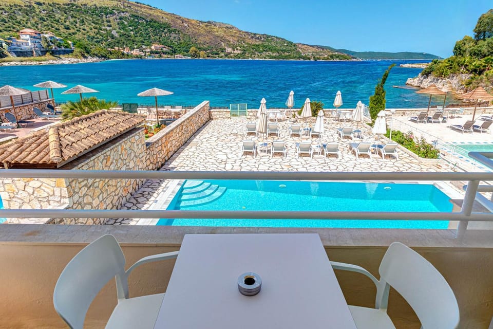Balcony/Terrace, Seating area, Beach, Pool view, Sea view