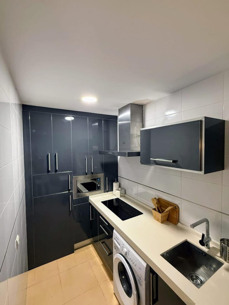 Kitchen or kitchenette, microwave, stove, washing machine