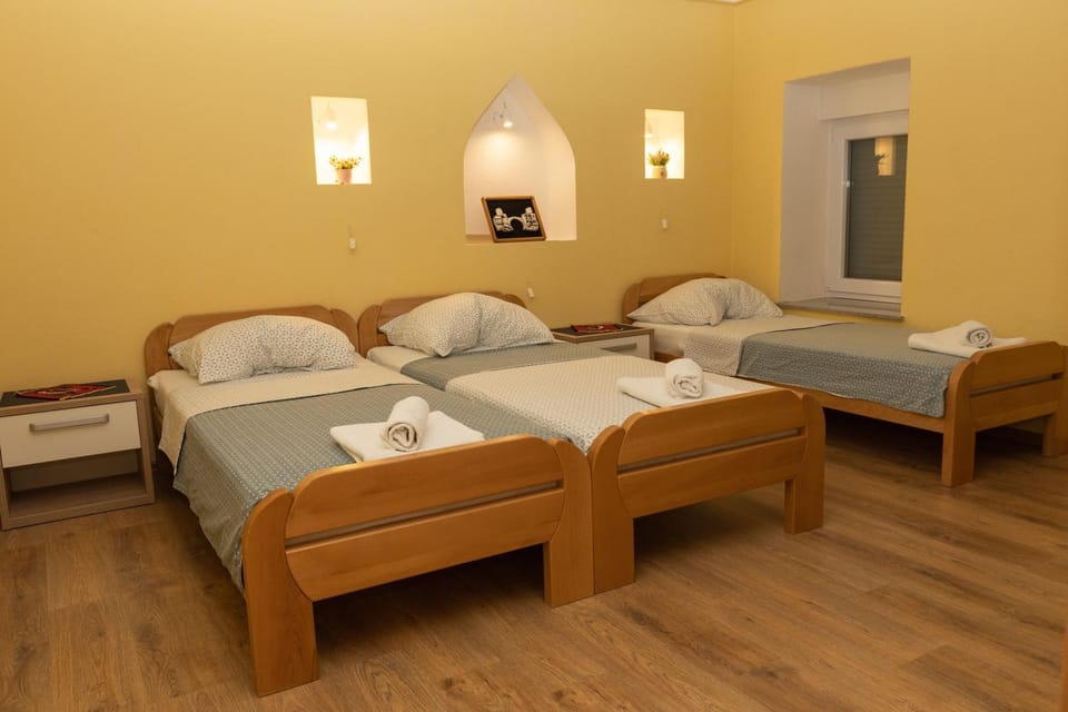 Bed, TV and multimedia, Seating area, Bedroom, towels, wardrobe, air conditioner
