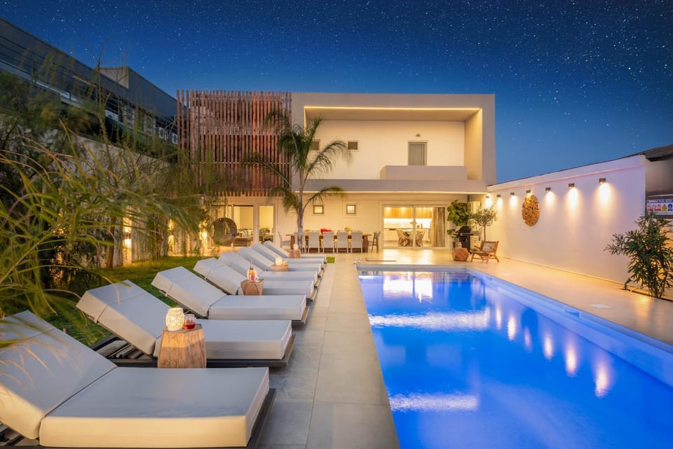 Property building, Patio, Night, Pool view, Swimming pool, sunbed