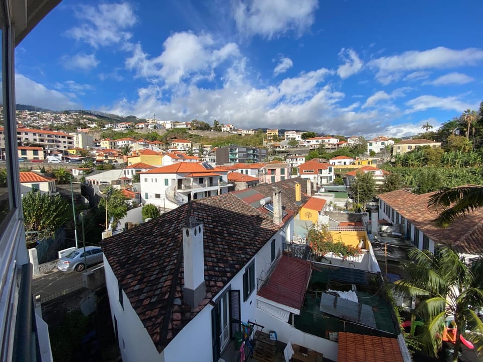 Property building, Day, Neighbourhood, Natural landscape, City view, Mountain view, Street view