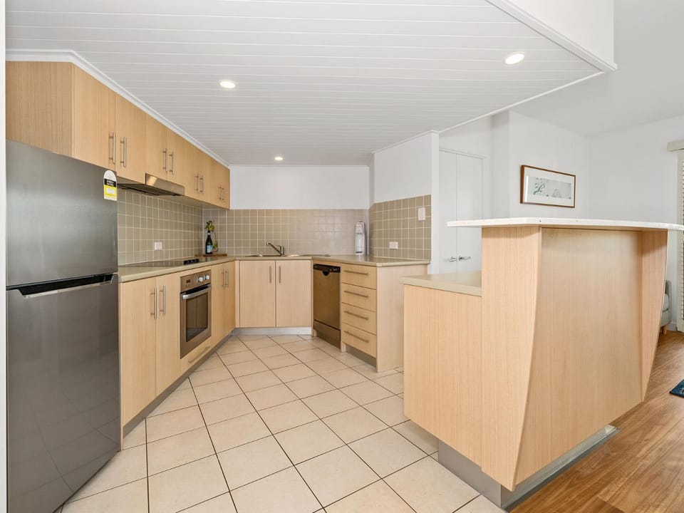 Kitchen or kitchenette, dishwasher, oven, stove