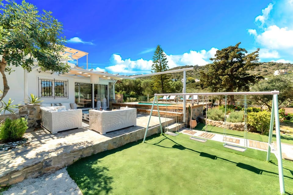 Property building, Patio, Spring, Day, Natural landscape, Garden, Living room, Seating area, Garden view, Mountain view, Pool view, Swimming pool