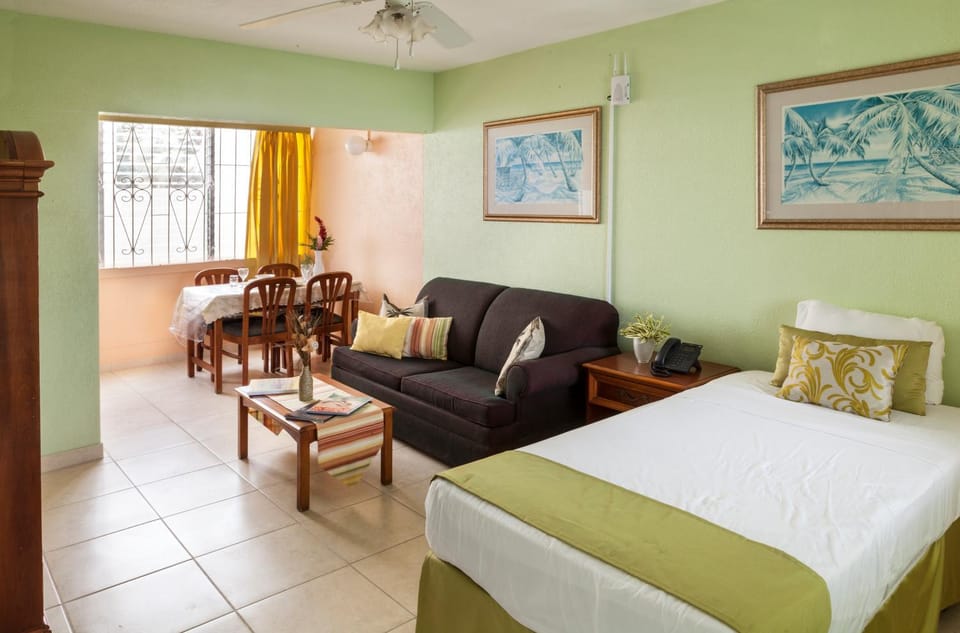 Bed, Living room, Seating area, Bedroom, fireplace