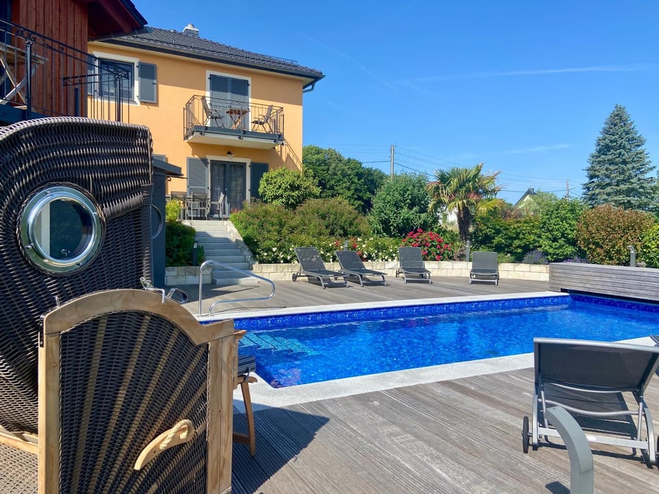 Property building, Pool view, Swimming pool, sunbed