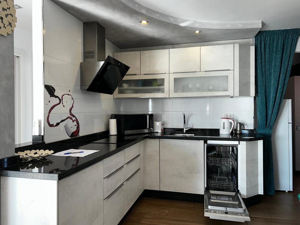 Kitchen or kitchenette, microwave, stove, kitchen