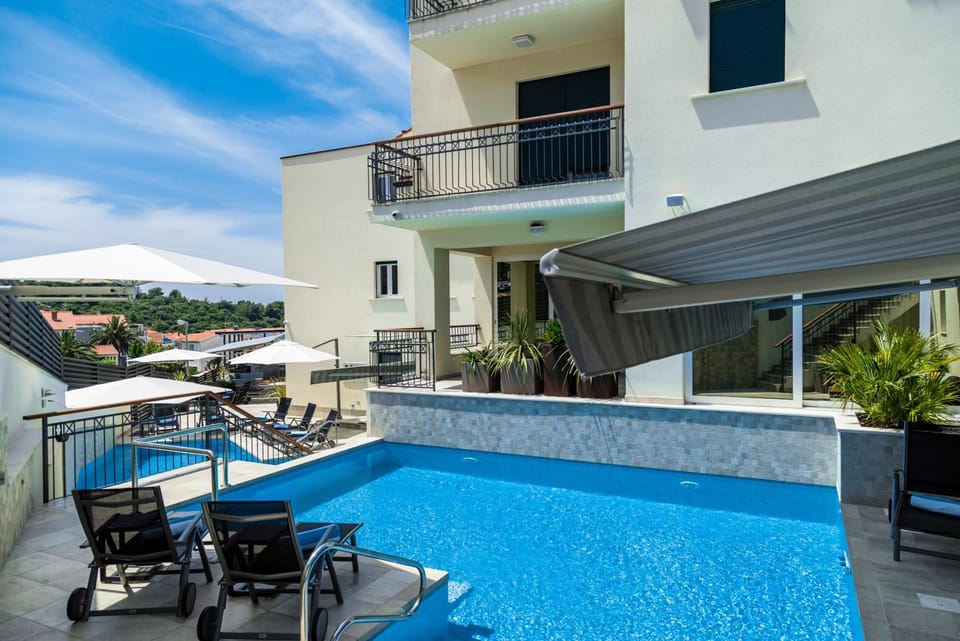 Property building, Patio, Day, View (from property/room), Balcony/Terrace, Pool view, Swimming pool, sunbed