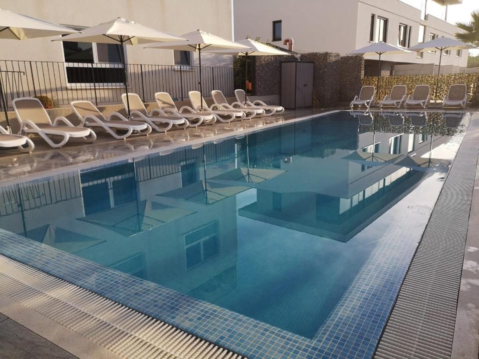 Property building, Swimming pool, sunbed