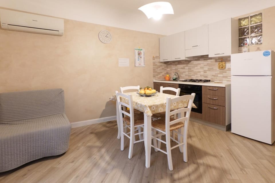 Kitchen or kitchenette, Seating area, Dining area, oven, stove, air conditioner