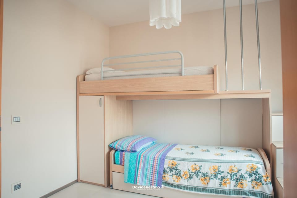 Bedroom, bunk bed, microwave, wardrobe