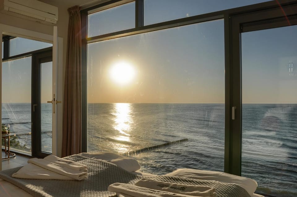 Bed, Day, Natural landscape, View (from property/room), Photo of the whole room, Beach, Bedroom, Sea view, Sunrise, Sunset, towels