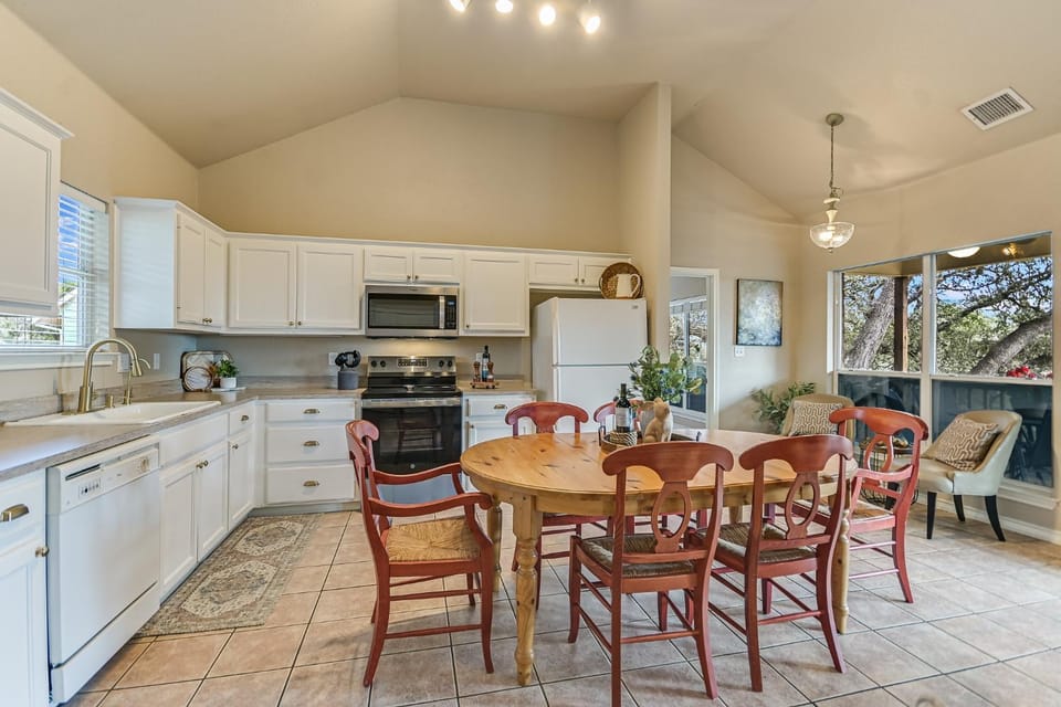 Kitchen or kitchenette, Dining area, fireplace, furniture, microwave, oven, laundry