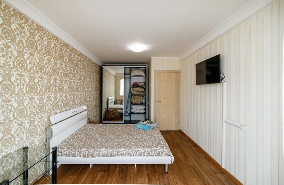 Bed, TV and multimedia, Seating area, Bedroom, furniture, furniture, towels, wardrobe, air conditioner