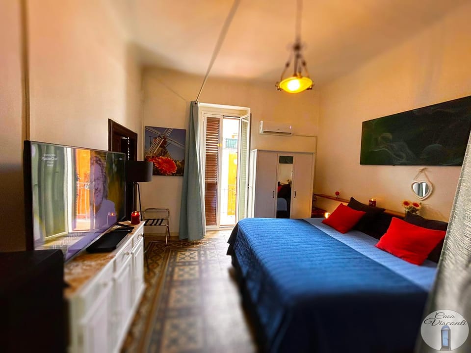 TV and multimedia, Decorative detail, Bedroom, microwave, towels, wardrobe, air conditioner