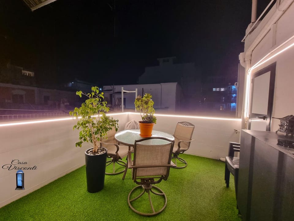 Property building, Patio, Patio, Night, Balcony/Terrace, Balcony/Terrace, Decorative detail, Decorative detail, Dining area, Diving, Dinner, Dinner