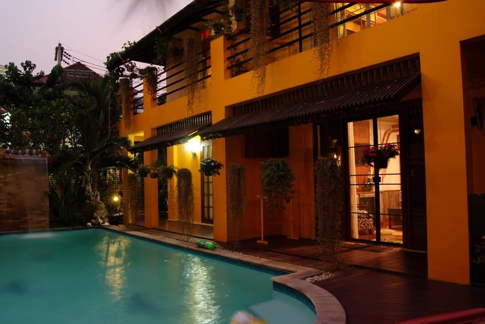 Property building, Patio, Night, Pool view, Swimming pool