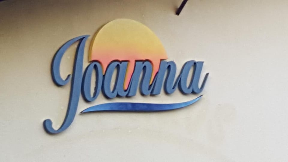 Property building, Spring, Day, Property logo or sign, Decorative detail, Logo/Certificate/Sign