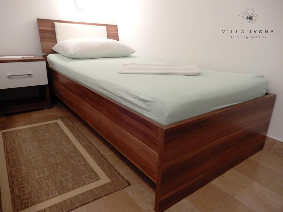 Bed, Property logo or sign, Bedroom