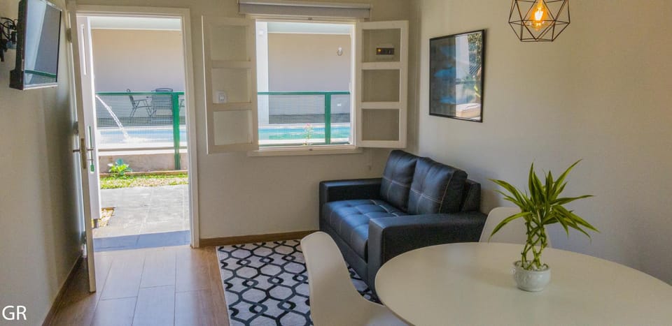 Living room, Seating area, Pool view