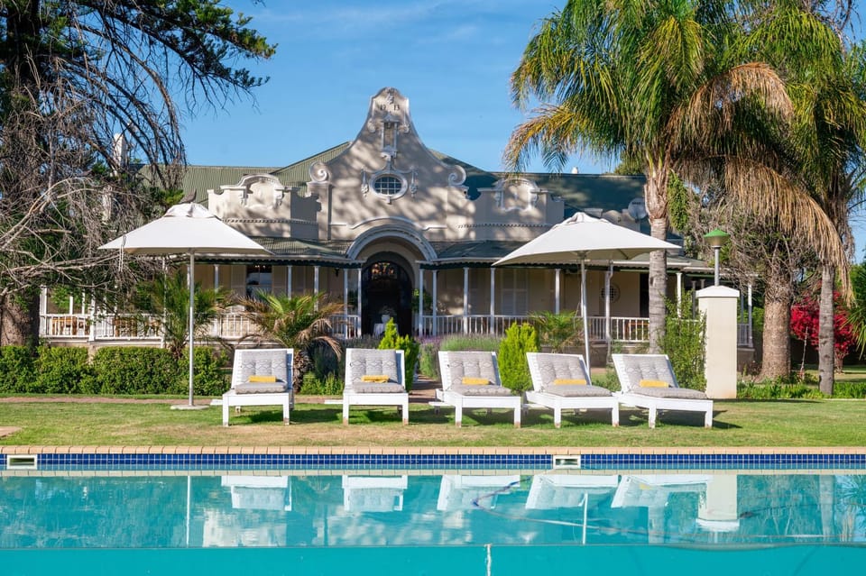 Property building, Natural landscape, Pool view, Swimming pool, sunbed