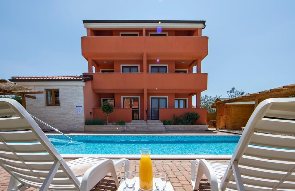 Property building, View (from property/room), Pool view, sunbed